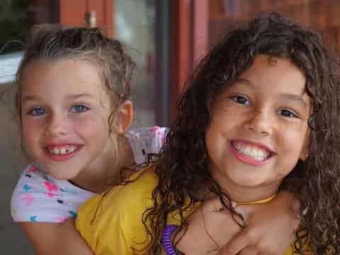 a couple of girls smiling