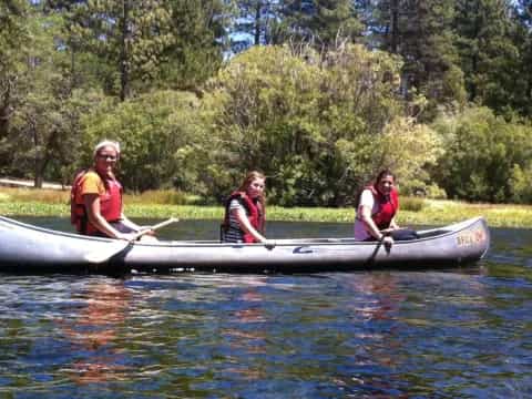 a group of people in a canoe