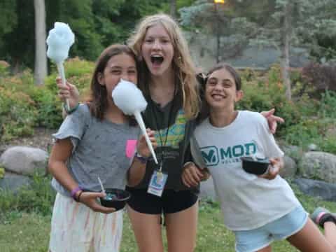 a group of girls holding a bird