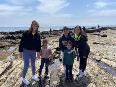 a group of people on a beach