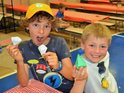 a couple of boys eating ice cream