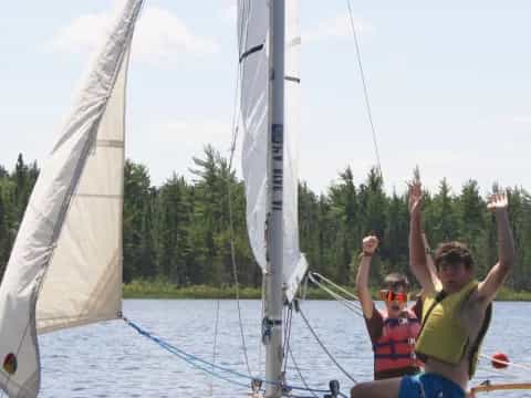 a group of people on a sailboat