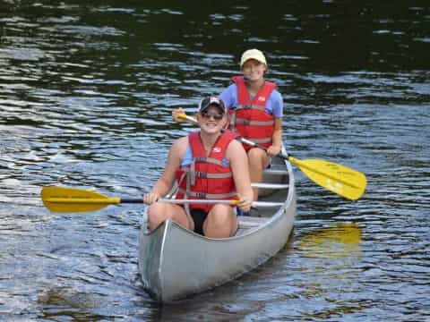 a couple of people in a canoe