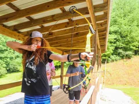 a person holding a bow and arrow