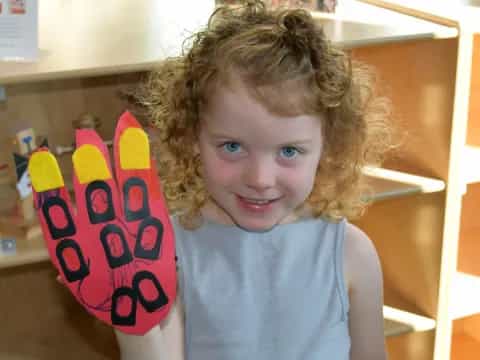 a child holding a cup