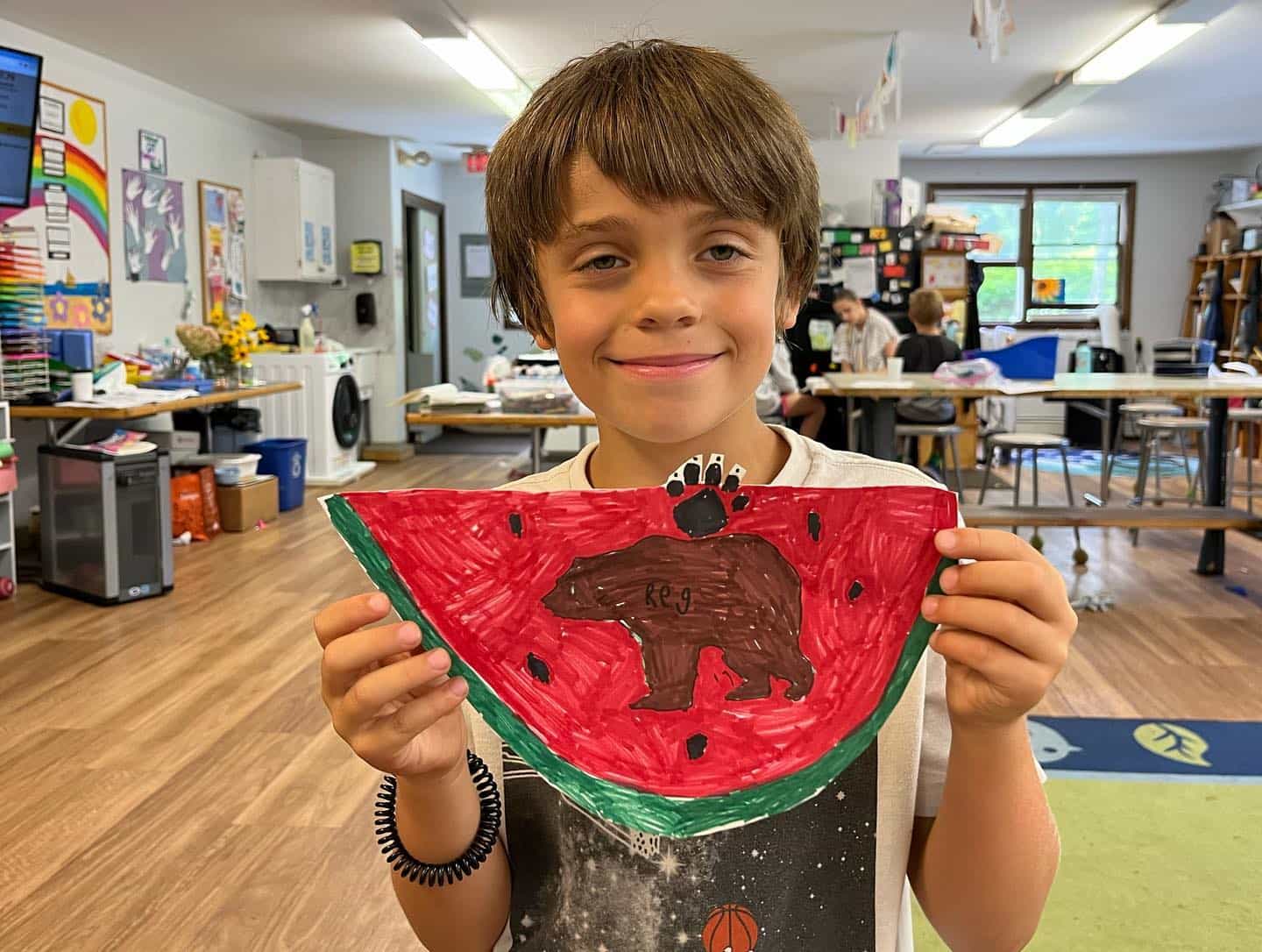 a boy holding a toy