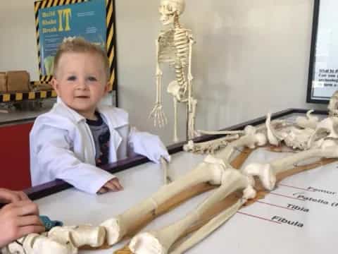 a child sitting at a desk
