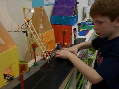 a boy playing with toys