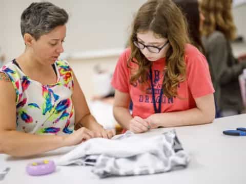 a person and a girl painting
