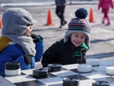 a group of children playing chess