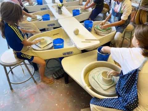 a group of children painting