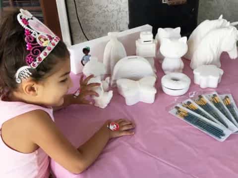 a little girl playing with a toy