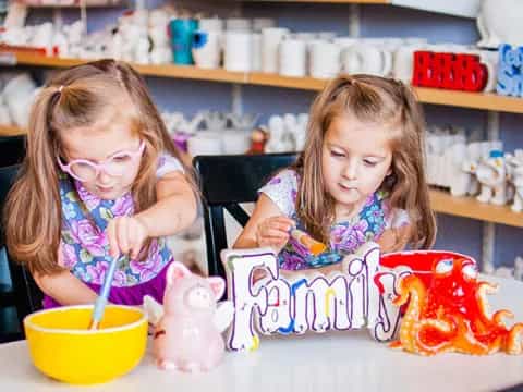 a couple of girls painting