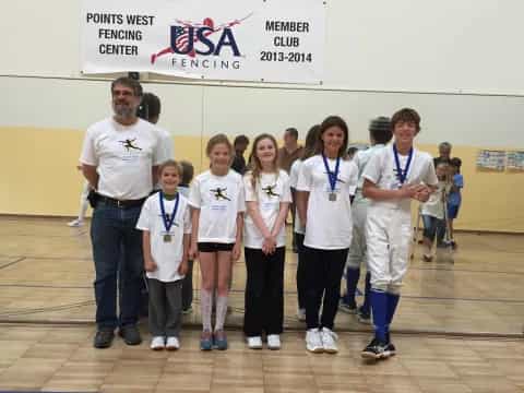 a group of people wearing medals