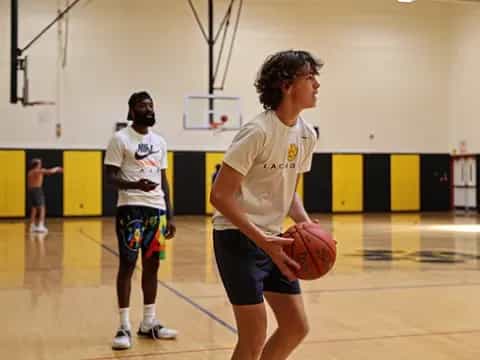 a person holding a basketball