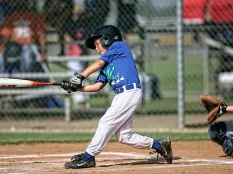 a young boy playing baseball