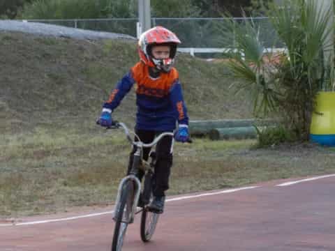 a boy riding a bicycle
