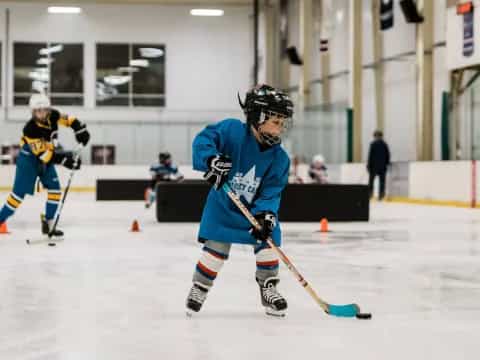 a couple of men playing hockey