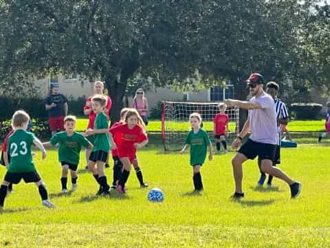 a group of kids playing football