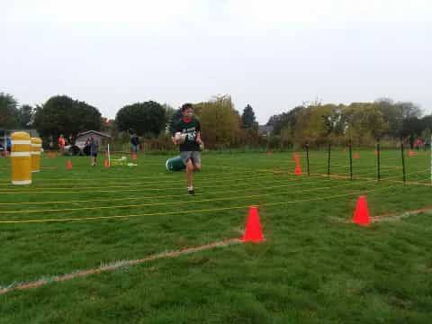 a person running on a grass field