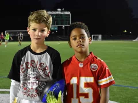 two boys in sports uniforms