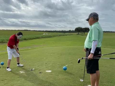 a couple of men playing golf