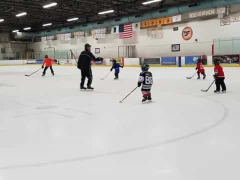 a group of people playing hockey