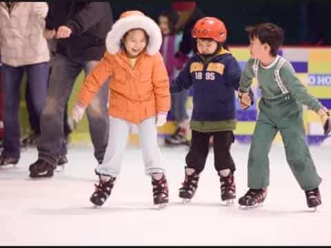 a group of kids ice skating