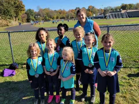 a group of people wearing medals