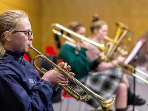 a woman playing a trumpet