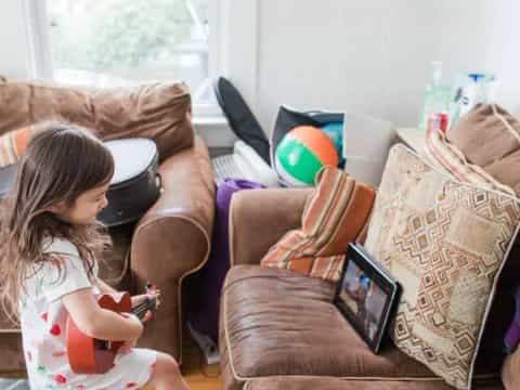 a girl sitting on a couch
