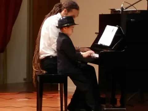 a man playing a piano
