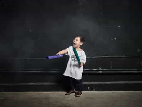 a boy holding a bat