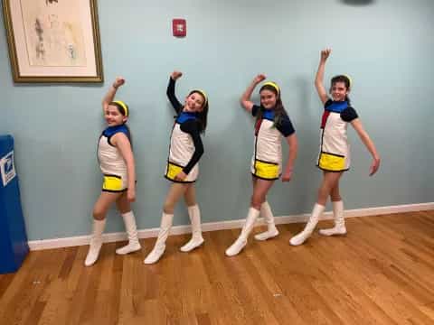 a group of girls in a room