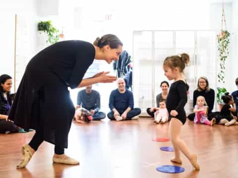 a person and a girl dancing