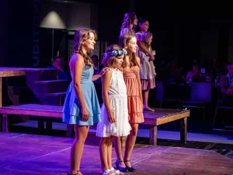 a group of women on a stage
