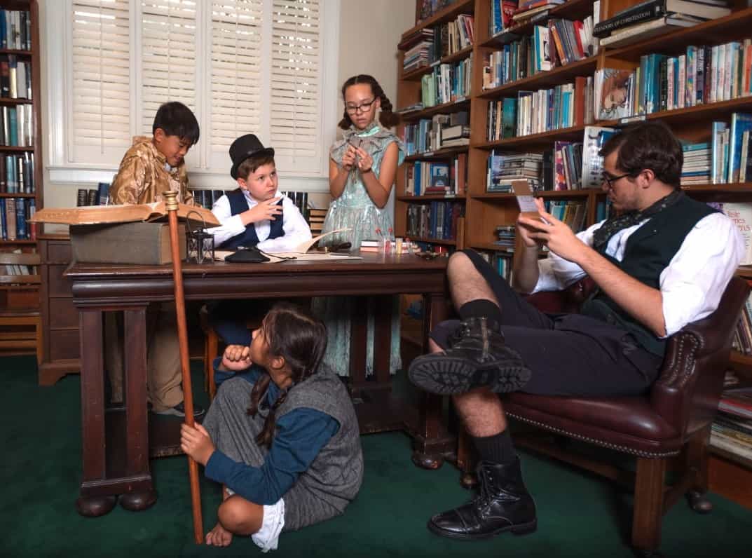 a group of people sitting around a table