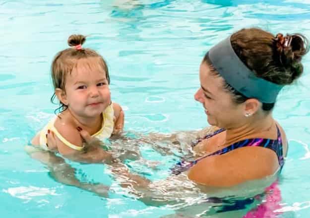 a person and a child in a pool