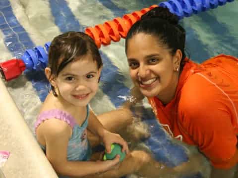 a person and a child in a pool