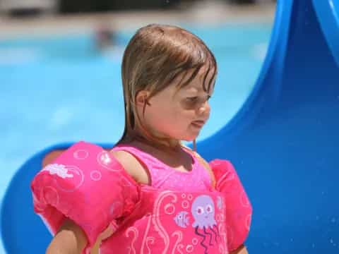 a baby in a pool