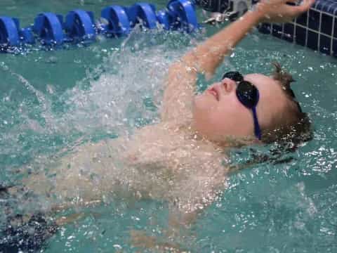 a person swimming in a pool