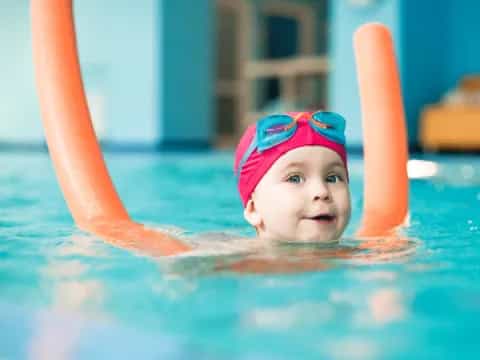 a baby in a pool