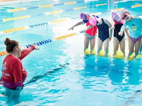 a group of people in a pool