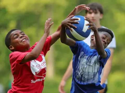 a group of boys playing rugby