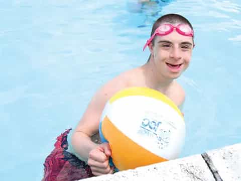 a woman holding a frisbee