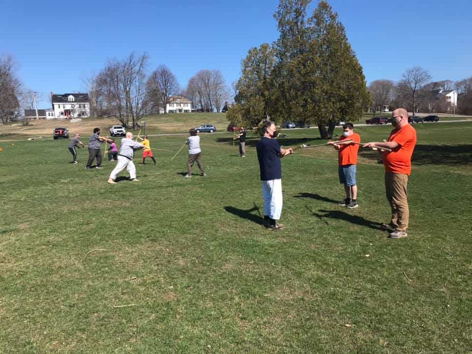 a group of people playing in a field