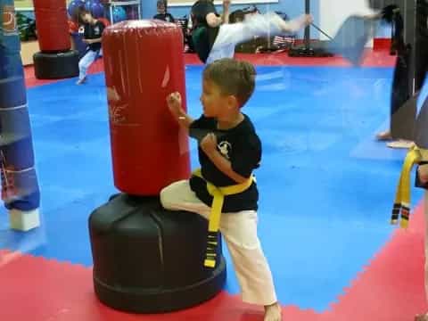 a boy playing with a toy