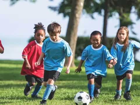 a group of kids playing football