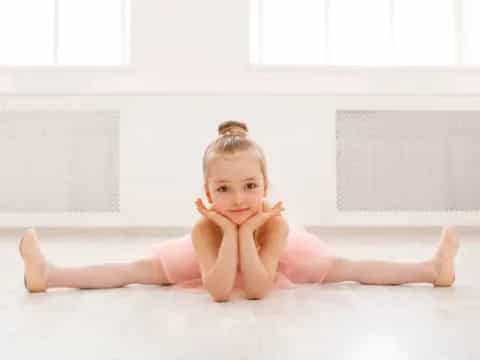 a baby lying on the floor