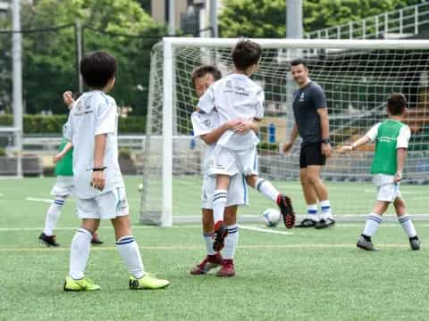 a group of kids playing football